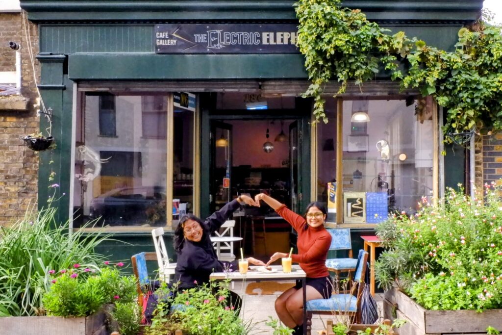 Friends sitting outside The Electric Elephant Cafe